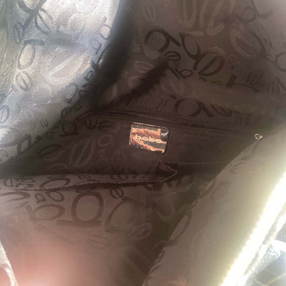 I am selling my BEBE purse it’s very unique I’ve never used it once - Picture 7 of 8